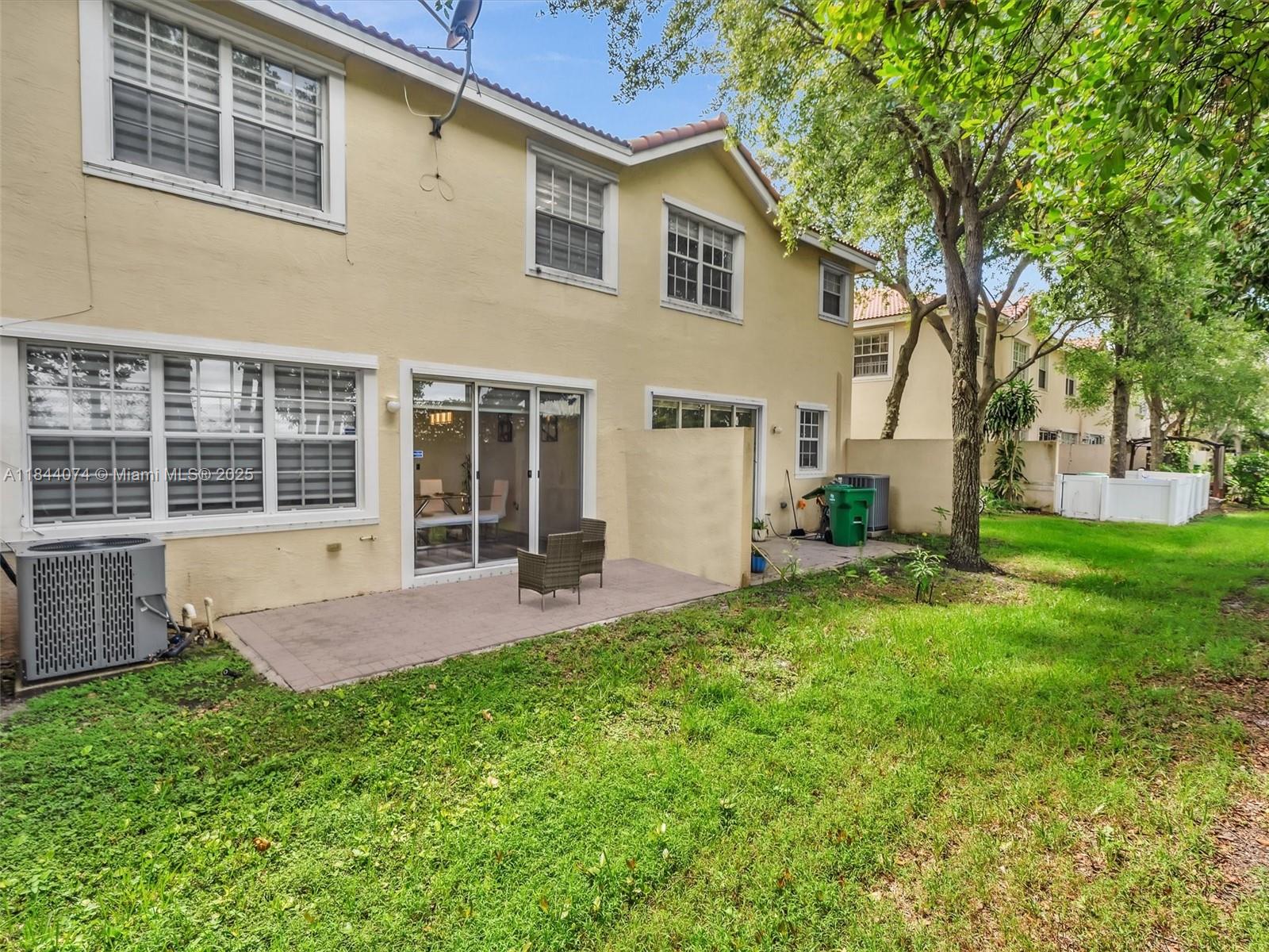4331 Southwest 124th Way Miramar, FL 33027 - Photo 23 of 58 a front view of a house with a yard and porch