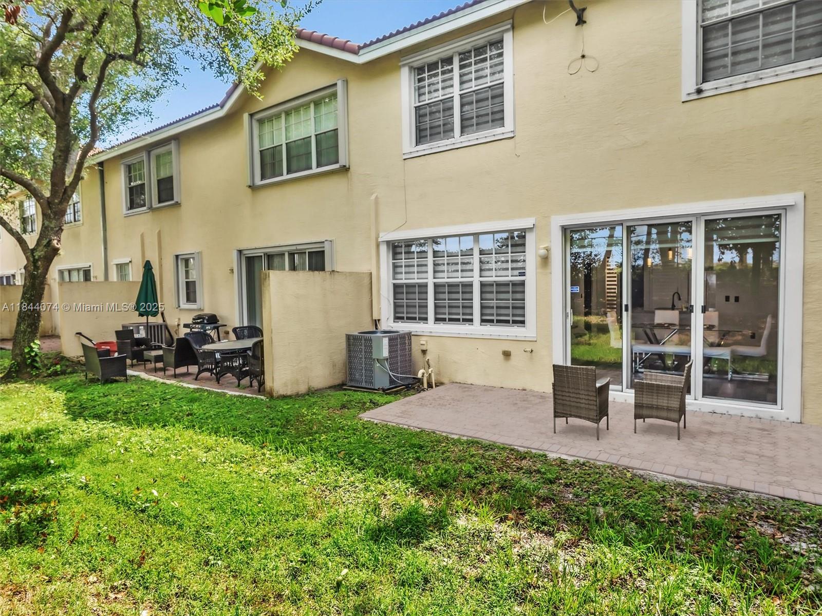 4331 Southwest 124th Way Miramar, FL 33027 - Photo 24 of 58 a view of a house with backyard porch and garden