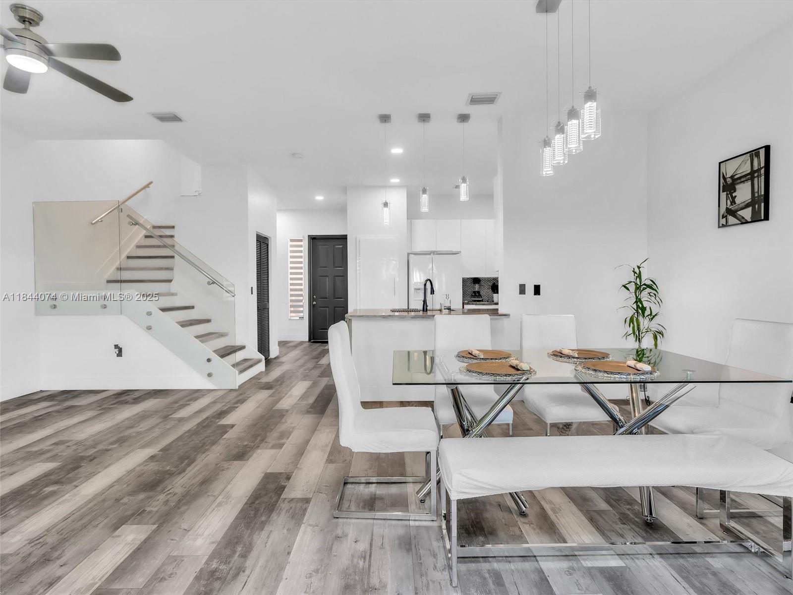 4331 Southwest 124th Way Miramar, FL 33027 - Photo 25 of 58 a living room with furniture and a chandelier