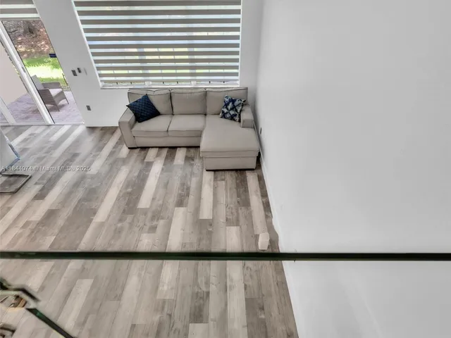 a bathroom with a toilet a sink a mirror and vanity