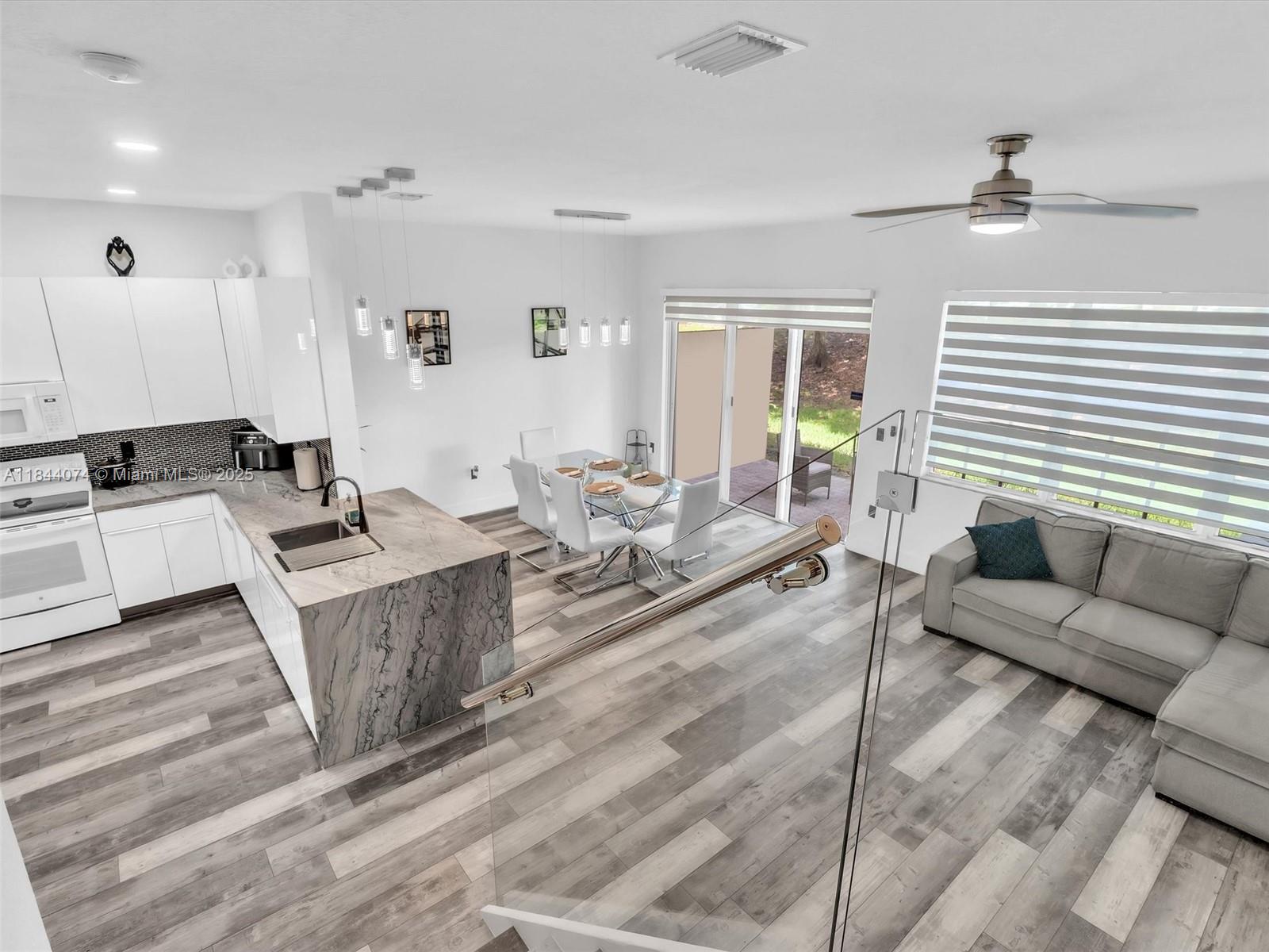 4331 Southwest 124th Way Miramar, FL 33027 - Photo 28 of 58 a living room with furniture and a large window