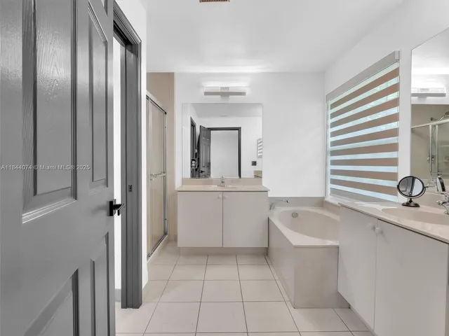 a view of a park with large trees