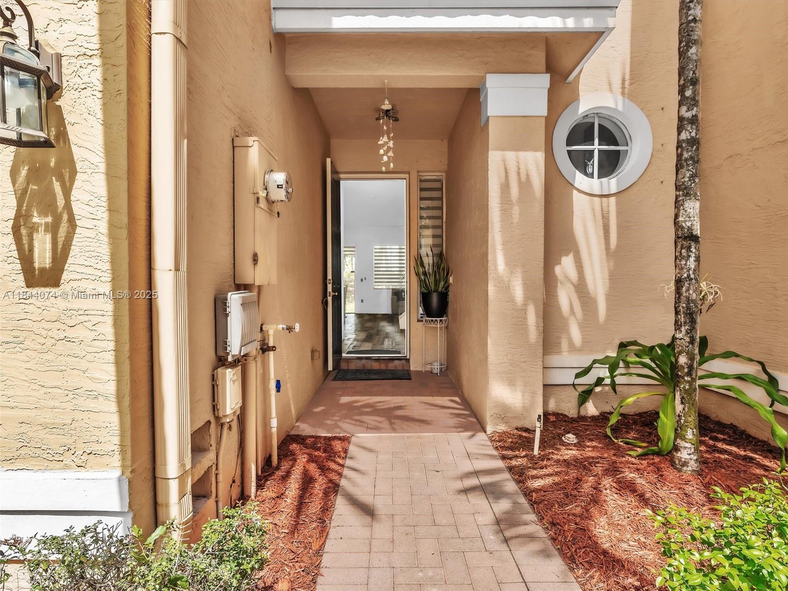 4331 Southwest 124th Way Miramar, FL 33027 - Photo 4 of 58 a front view of a house with a chairs