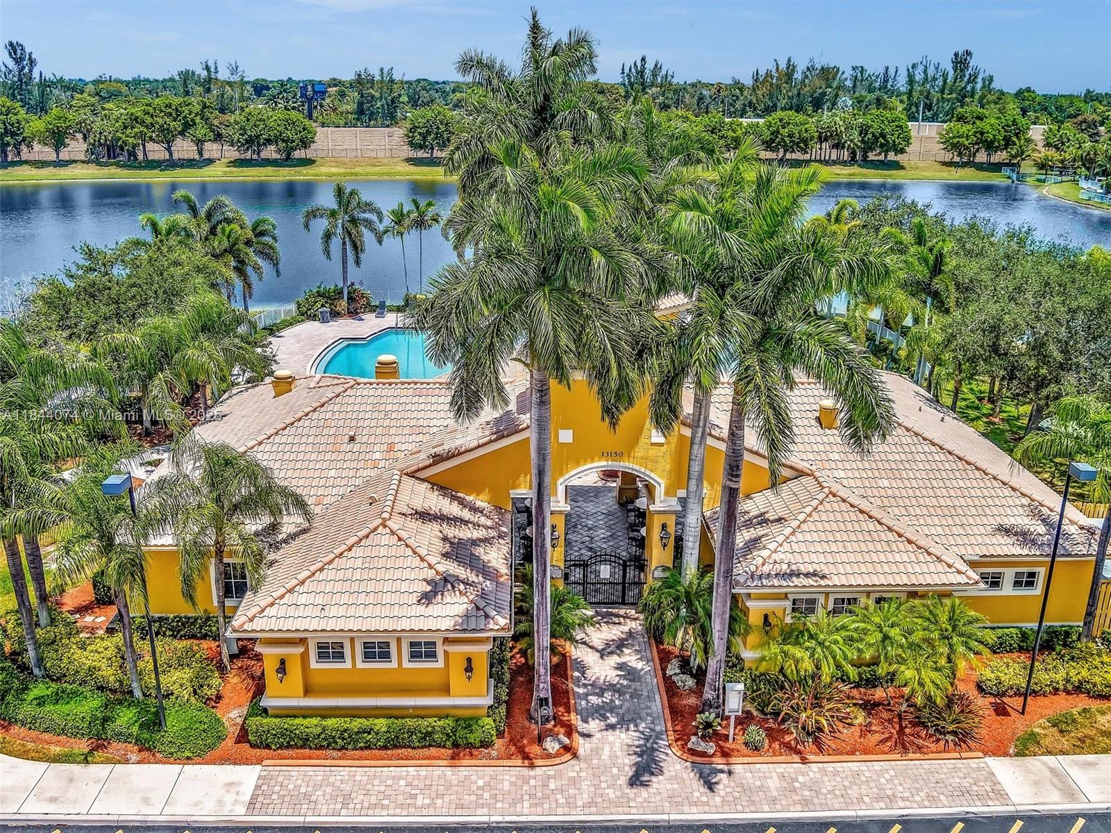 4331 Southwest 124th Way Miramar, FL 33027 - Photo 50 of 58 an aerial view of residential houses with outdoor space and lake view