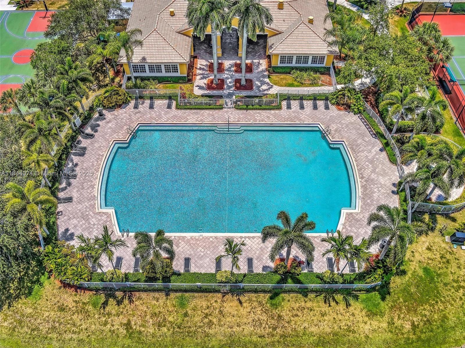 4331 Southwest 124th Way Miramar, FL 33027 - Photo 54 of 58 a view of swimming pool with a yard
