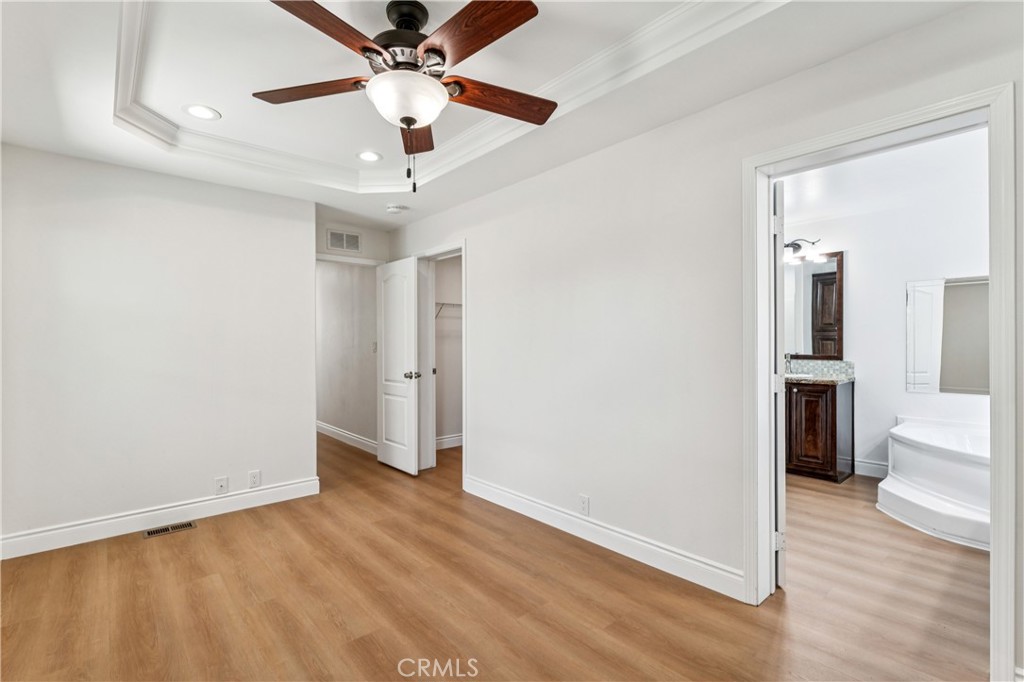 10550 Dunlap Crossing Road, Unit 141 Whittier, CA 90606 - Photo 19 of 38 wooden floor in an empty room with a window
