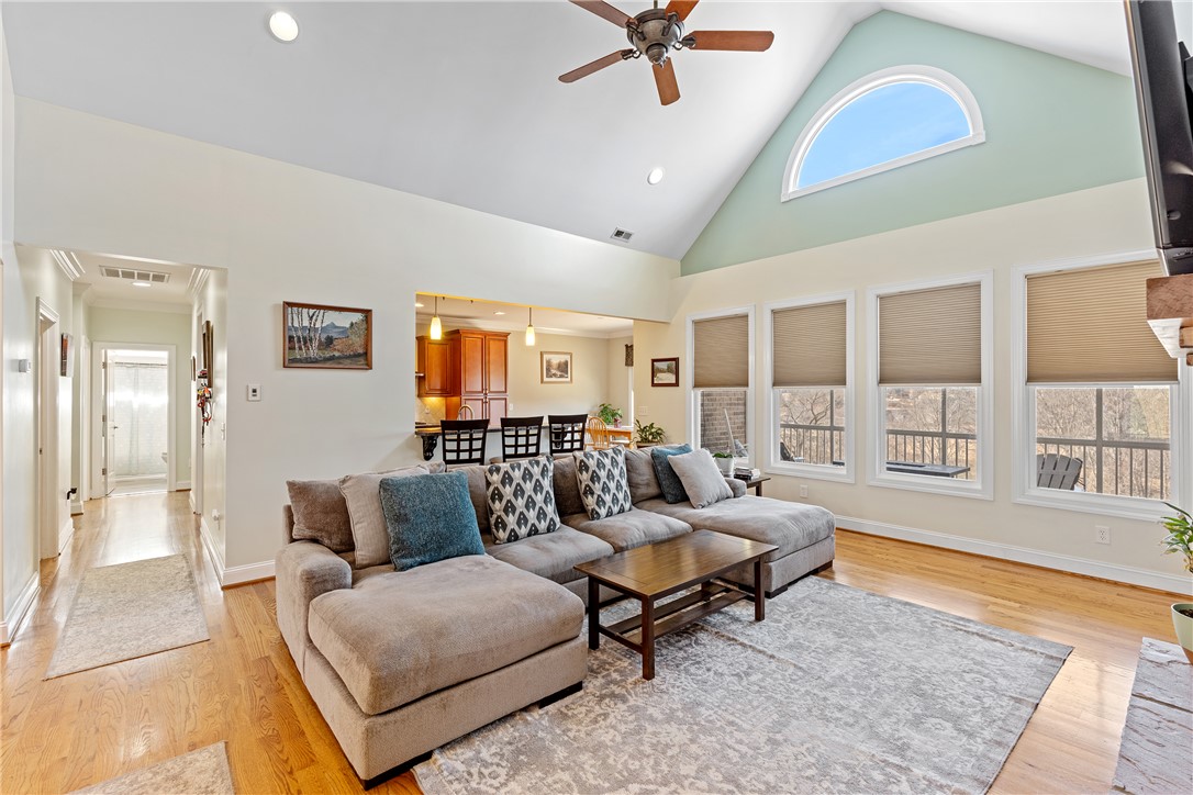 119 Turnberry Road Anderson, SC 29621 - Photo 12 of 50 This airy living space features soaring vaulted ceilings and rich hardwood flooring.
