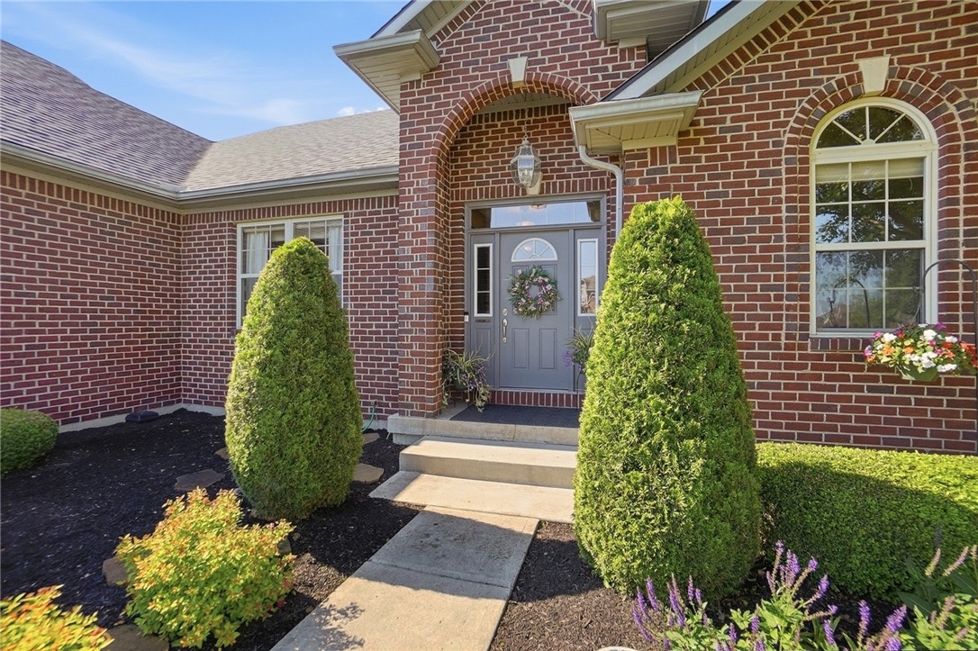 710 Governors Road Troy, OH 45373 - Photo 5 of 56 This residence features a timeless brick exterior with classic architectural details and inviting entryway.