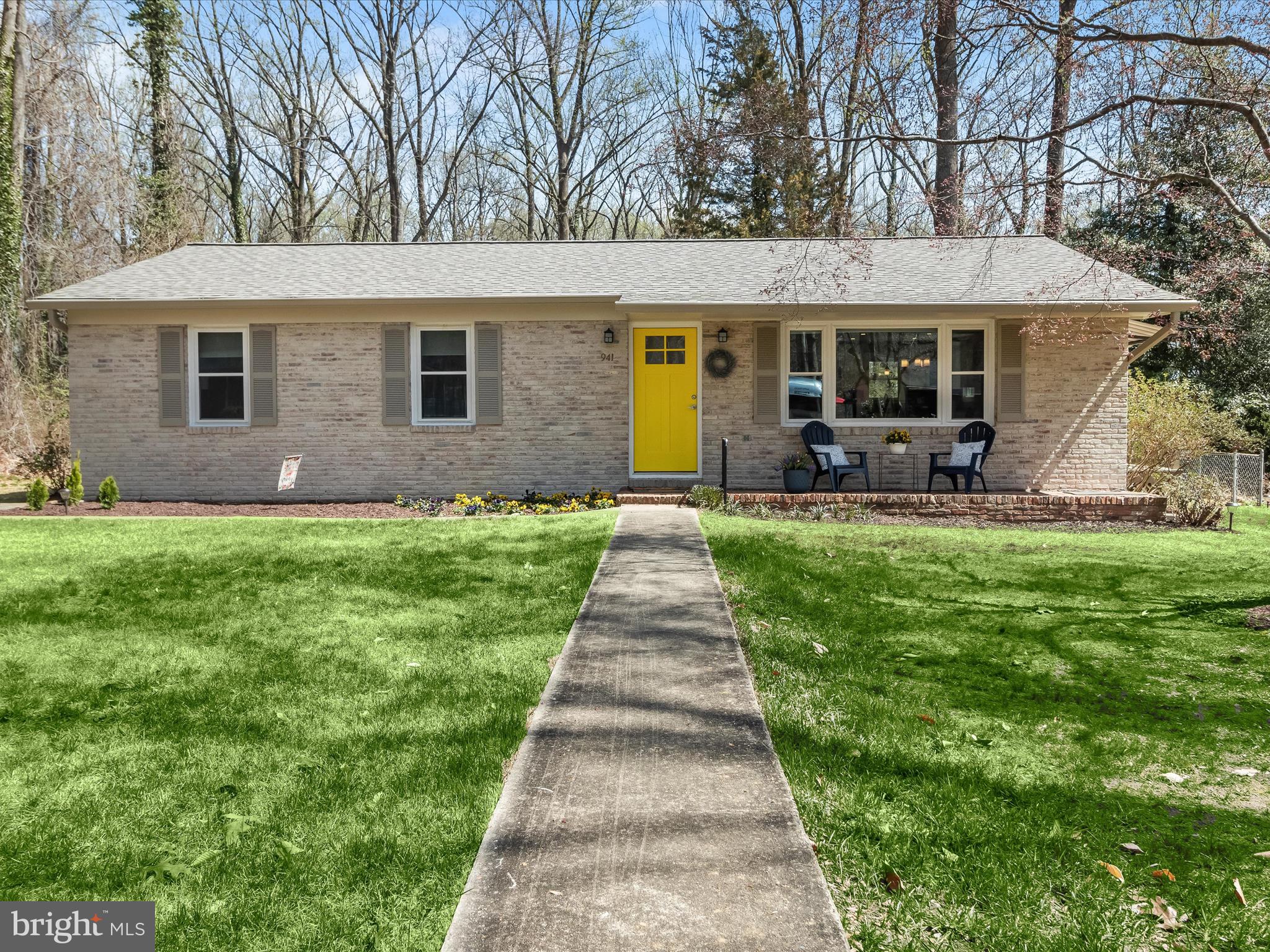 941 Buttonwood Trail Crownsville, MD 21032 - Photo 24 of 43 a front view of a house with a garden and trees