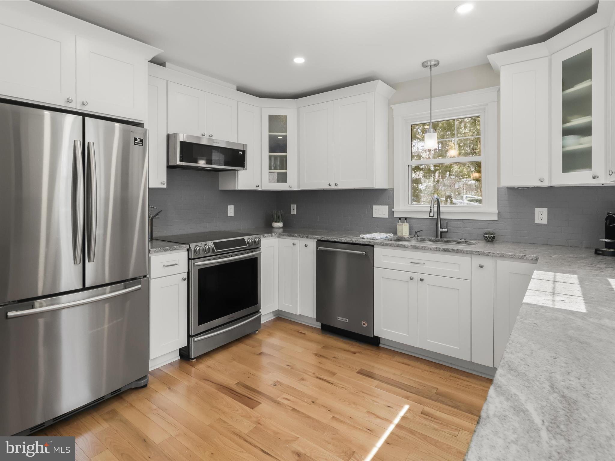 941 Buttonwood Trail Crownsville, MD 21032 - Photo 3 of 43 a kitchen with stainless steel appliances a refrigerator sink and microwave