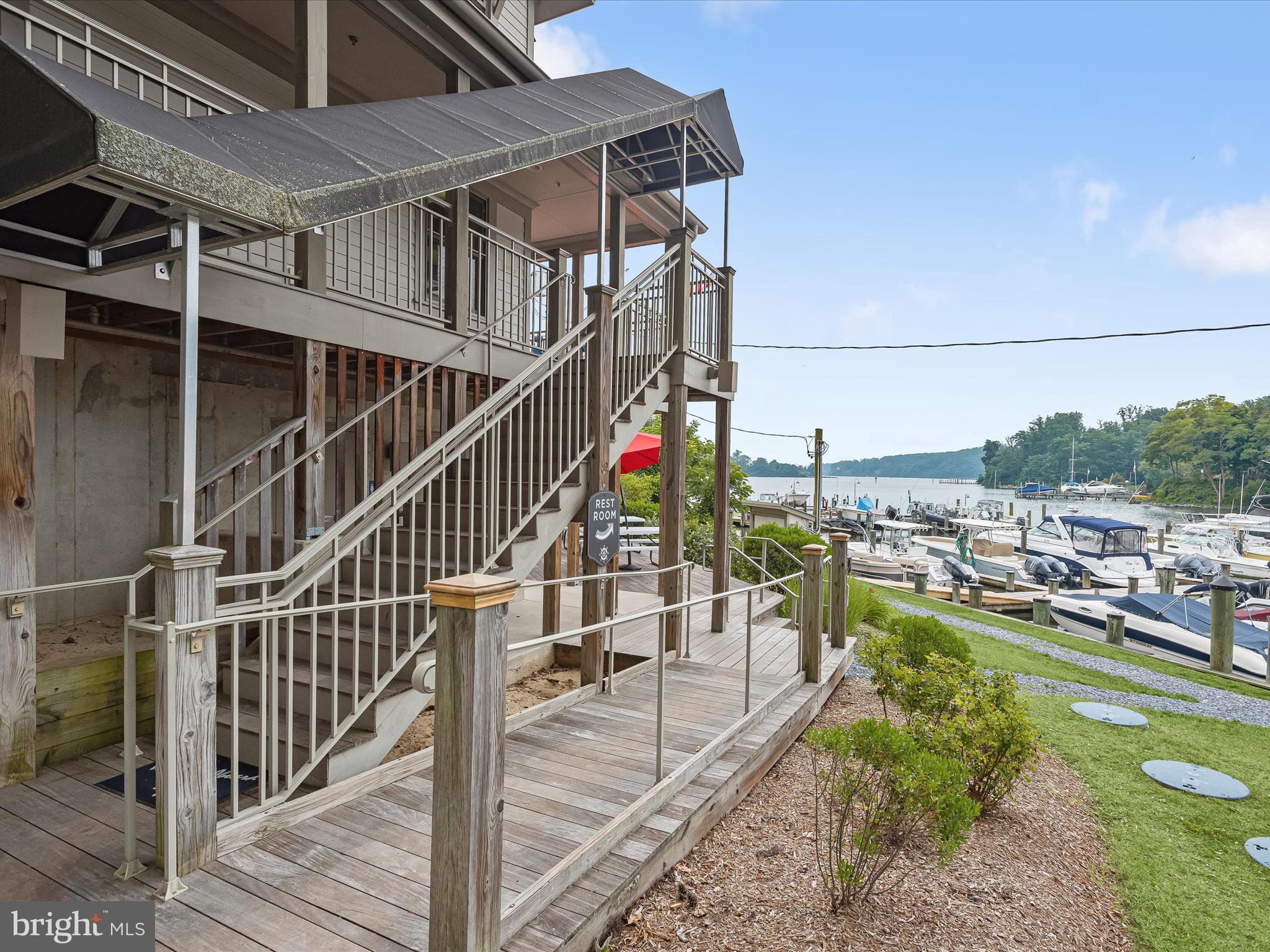 941 Buttonwood Trail Crownsville, MD 21032 - Photo 42 of 43 a view of a balcony with chairs and wooden floor