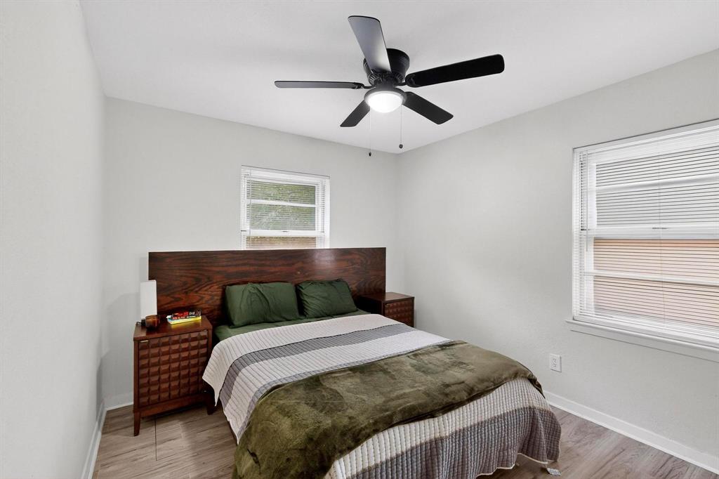 10834 Cassandra Way Dallas, TX 75228 - Photo 13 of 20 a bedroom with a bed and window