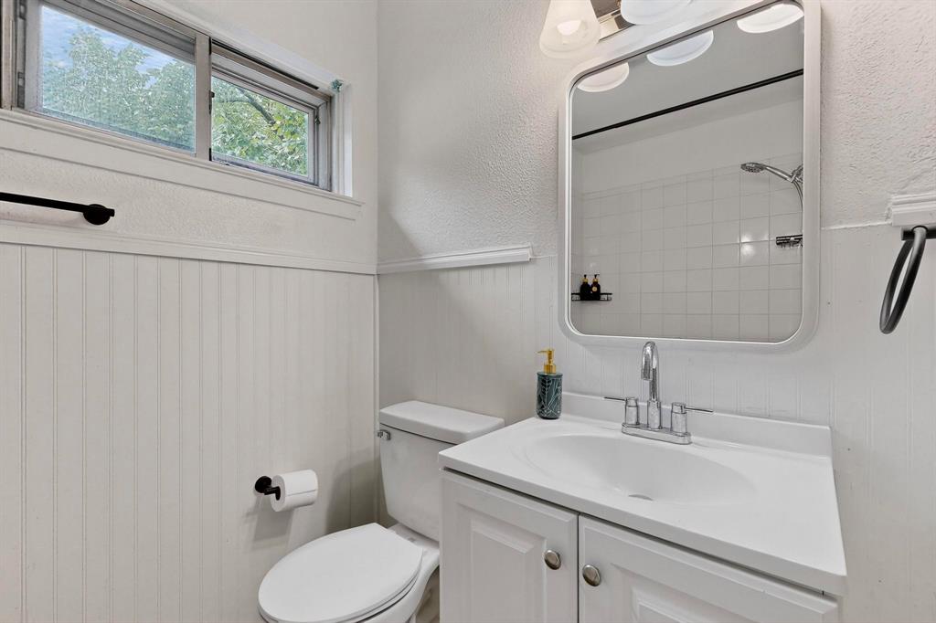 10834 Cassandra Way Dallas, TX 75228 - Photo 16 of 20 a bathroom with a sink toilet and shower