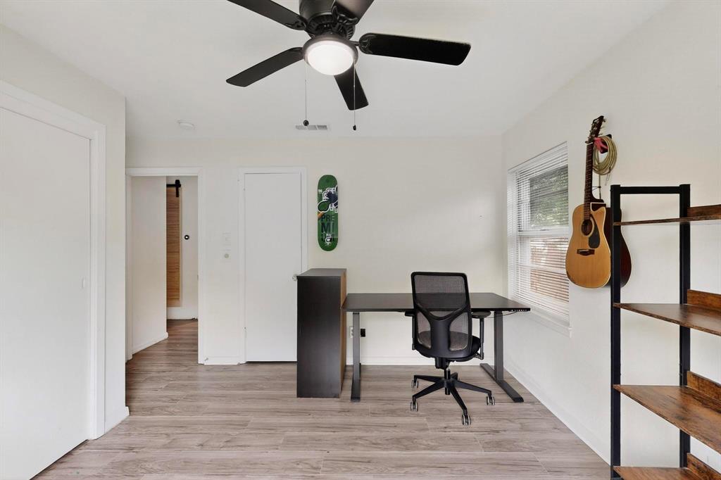 10834 Cassandra Way Dallas, TX 75228 - Photo 18 of 20 a view of a workspace with furniture and wooden floor