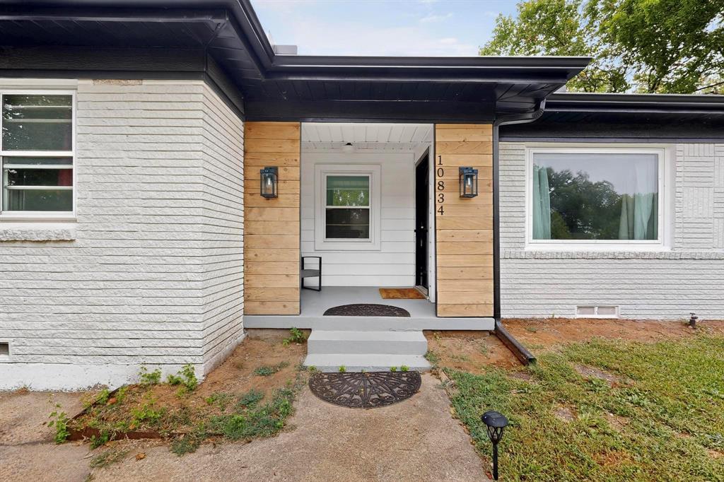 10834 Cassandra Way Dallas, TX 75228 - Photo 2 of 20 a front view of a house with a yard