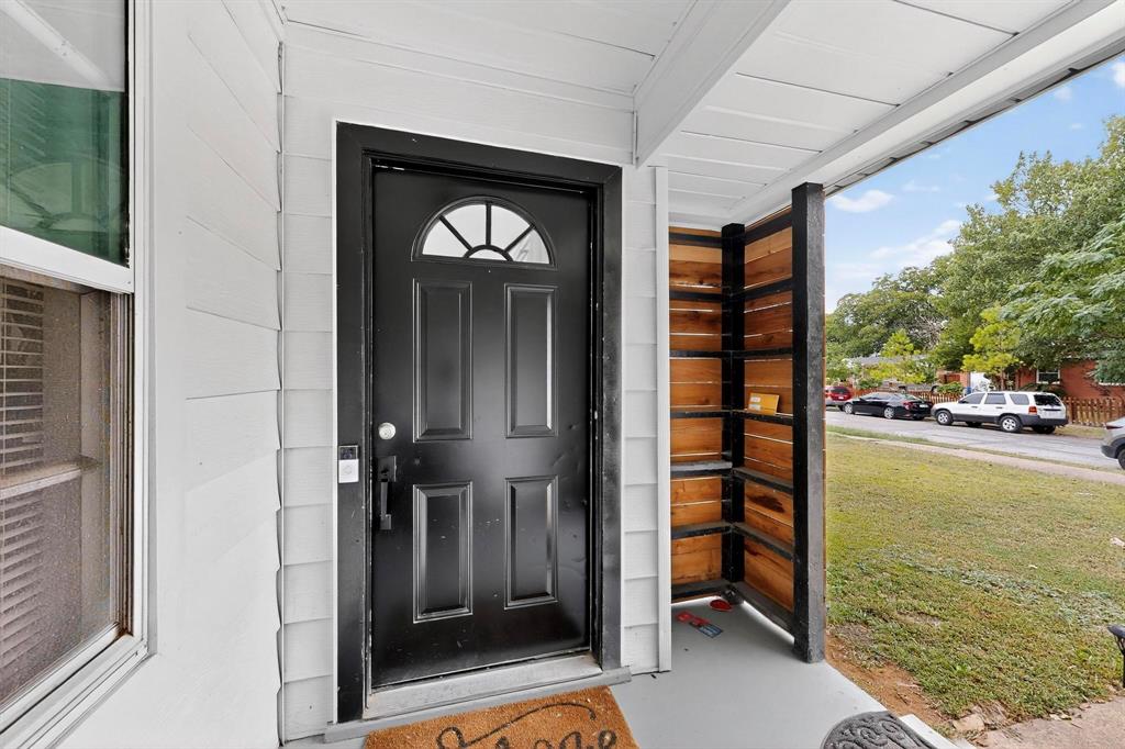 10834 Cassandra Way Dallas, TX 75228 - Photo 3 of 20 a view of living room kitchen and entryway
