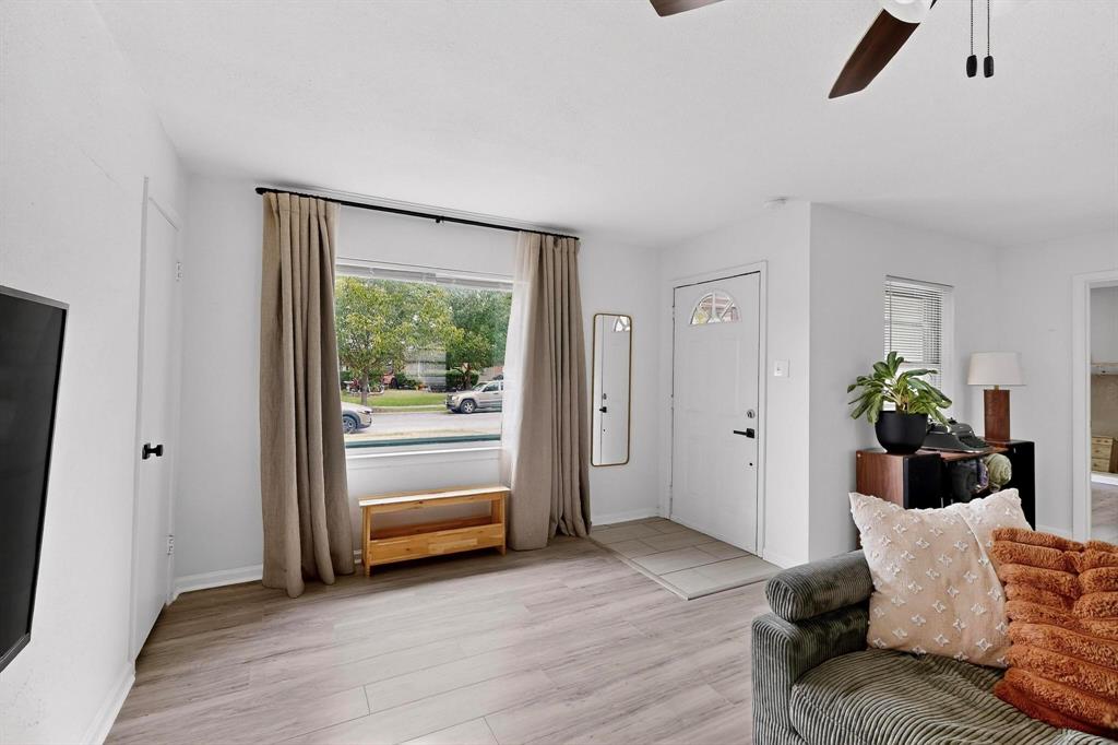 10834 Cassandra Way Dallas, TX 75228 - Photo 6 of 20 a living room with furniture and a window