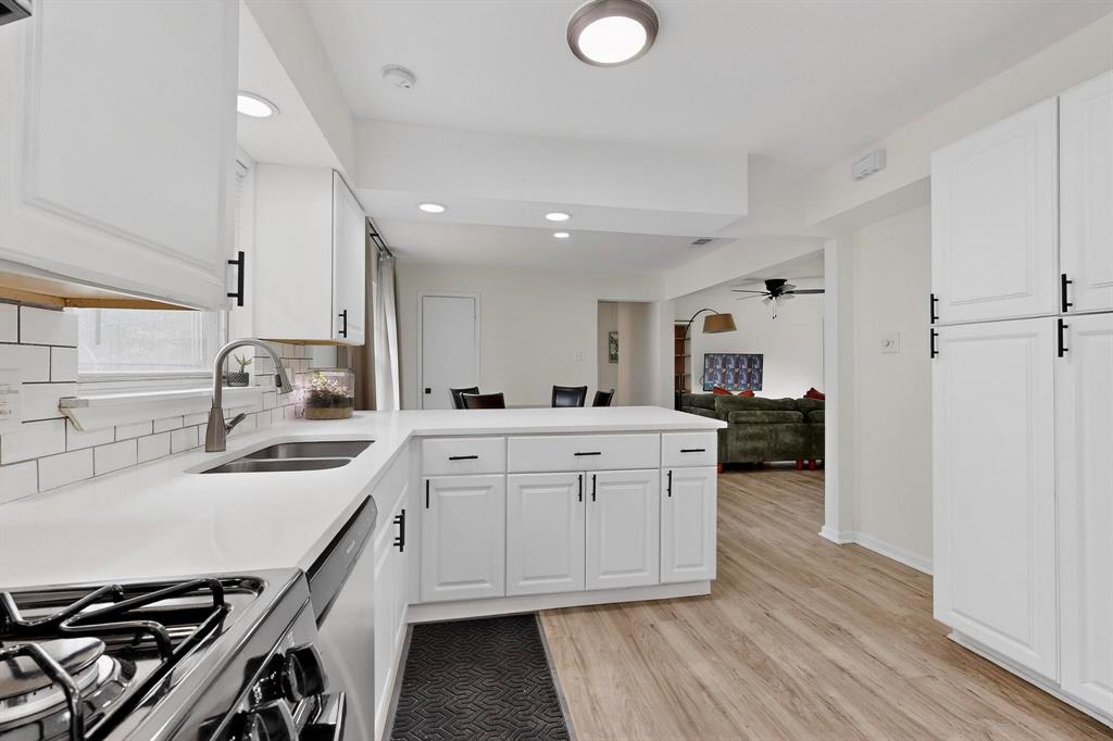 10834 Cassandra Way Dallas, TX 75228 - Photo 9 of 20 a kitchen with a sink appliances and cabinets