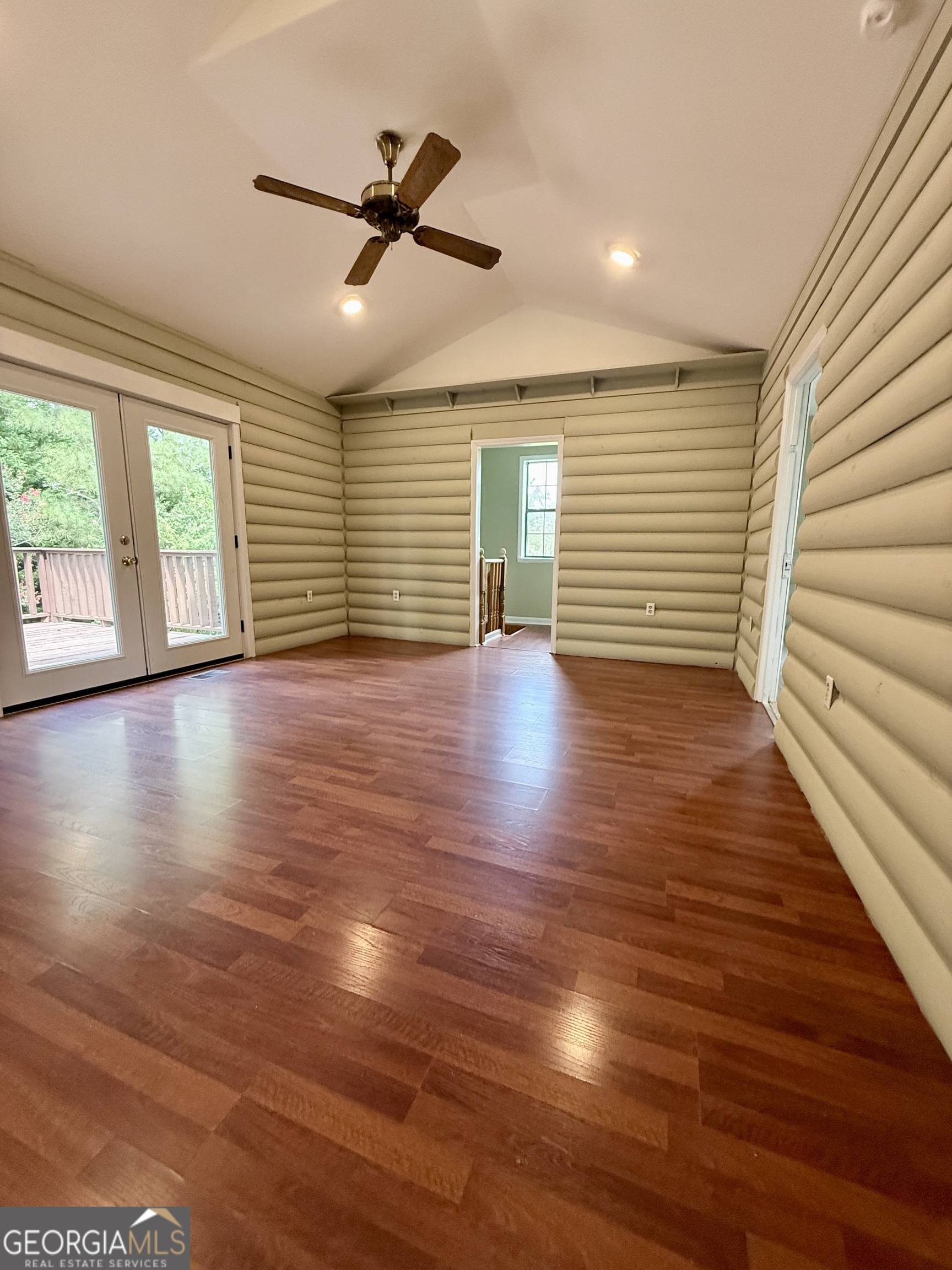 2592 White Oak Road Thomson, GA 30824 - Photo 14 of 30 a view of an empty room with wooden floor and a window