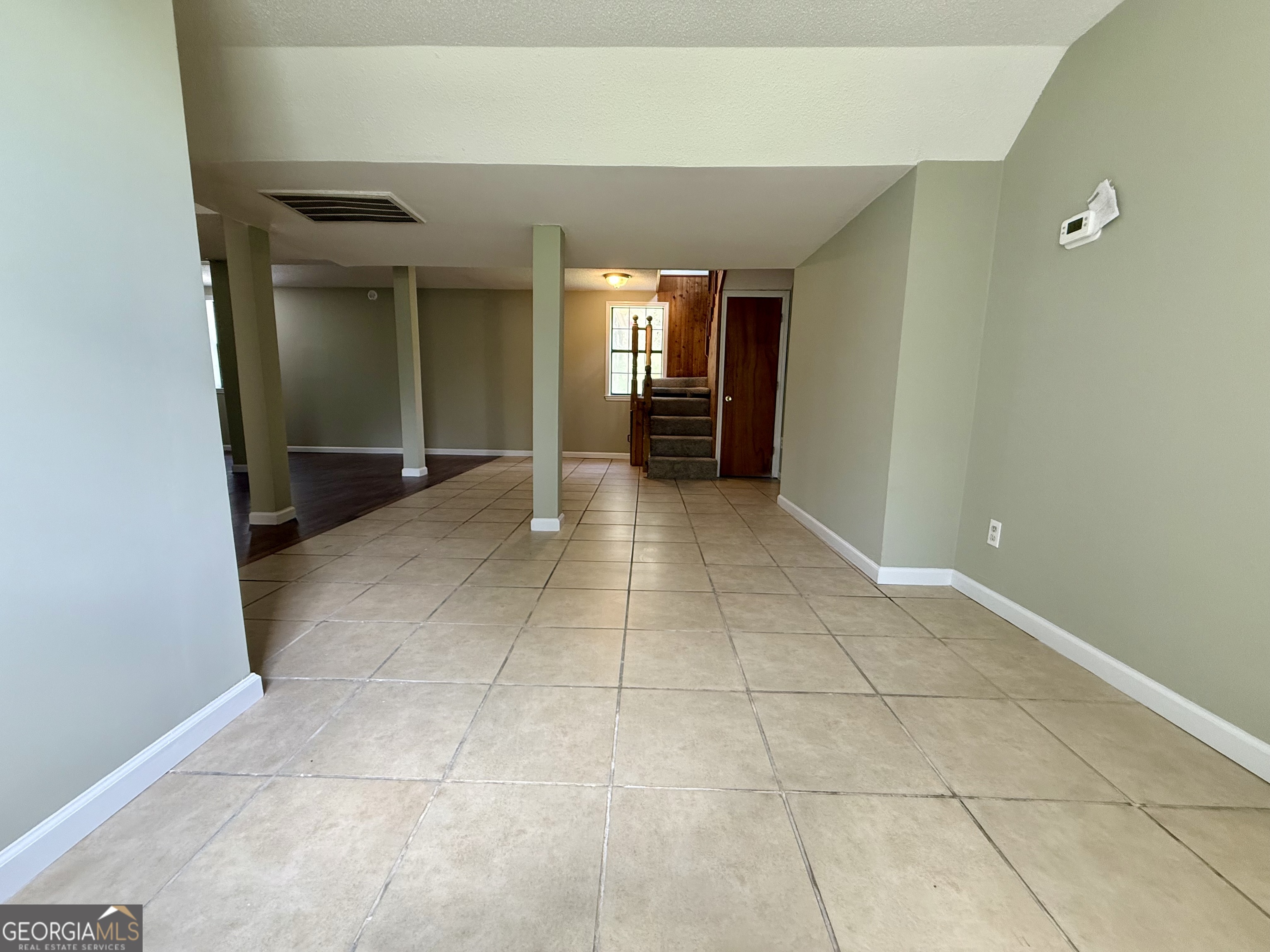 2592 White Oak Road Thomson, GA 30824 - Photo 16 of 30 wooden floor in an empty room and a bathroom