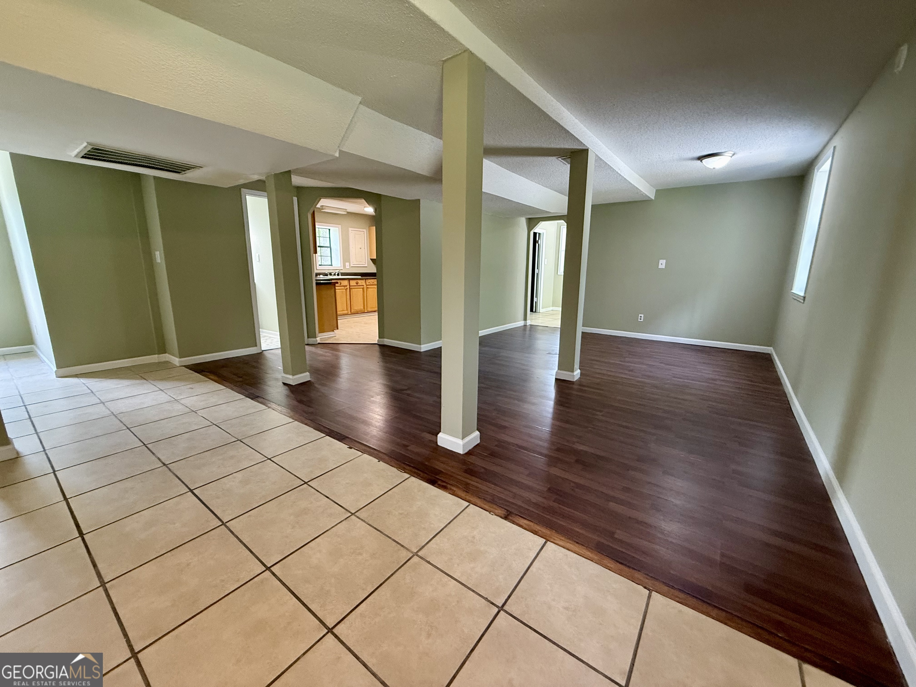 2592 White Oak Road Thomson, GA 30824 - Photo 18 of 30 a view of empty room with wooden floor