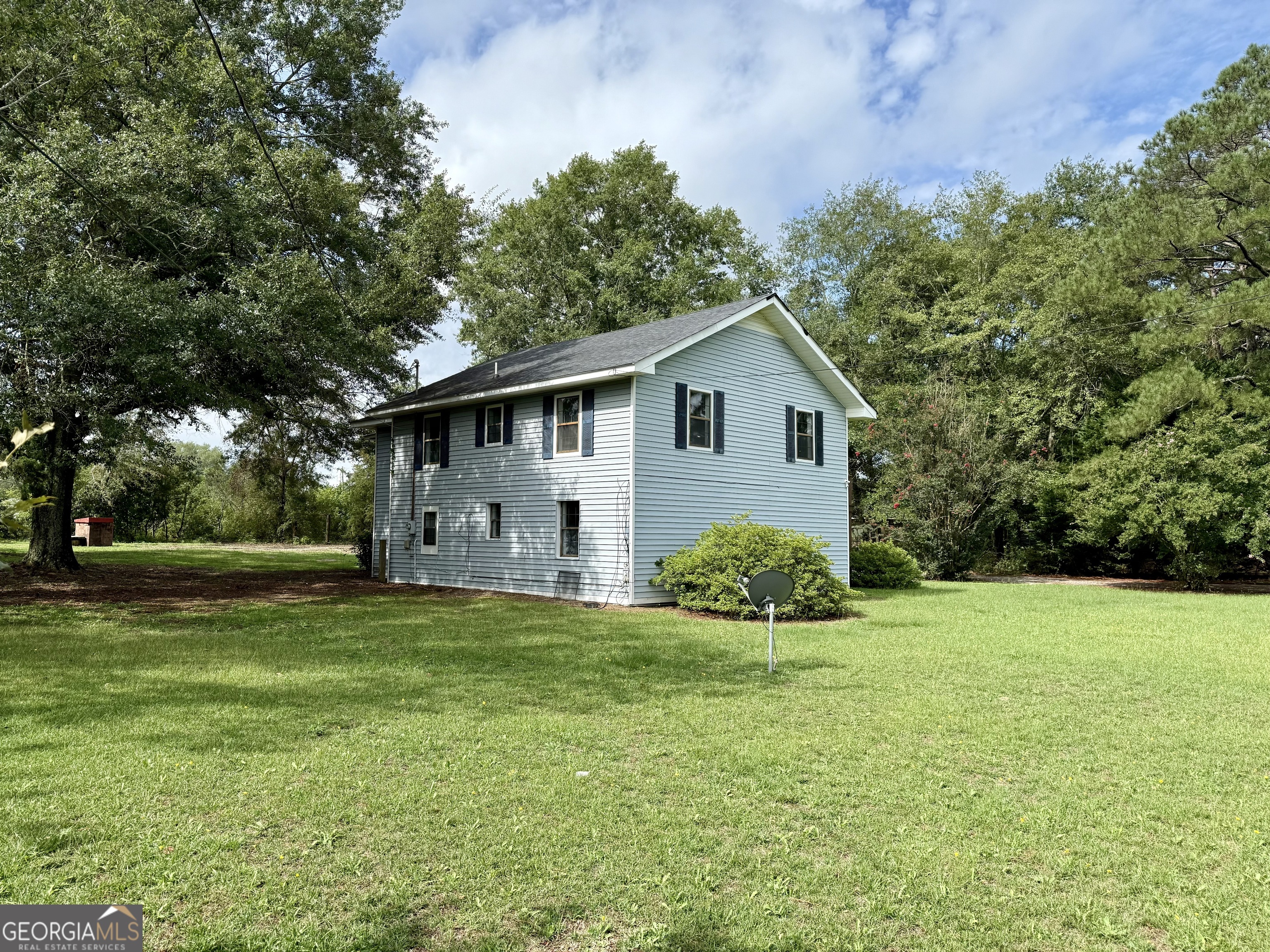 2592 White Oak Road Thomson, GA 30824 - Photo 25 of 30 a view of a house with a yard