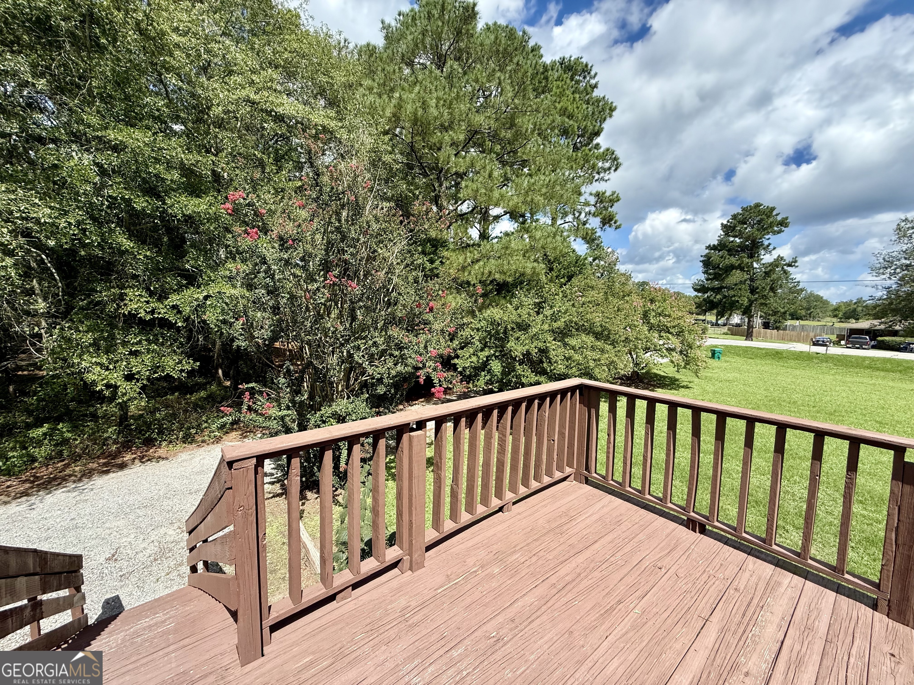 2592 White Oak Road Thomson, GA 30824 - Photo 29 of 30 a balcony with wooden floor and fence