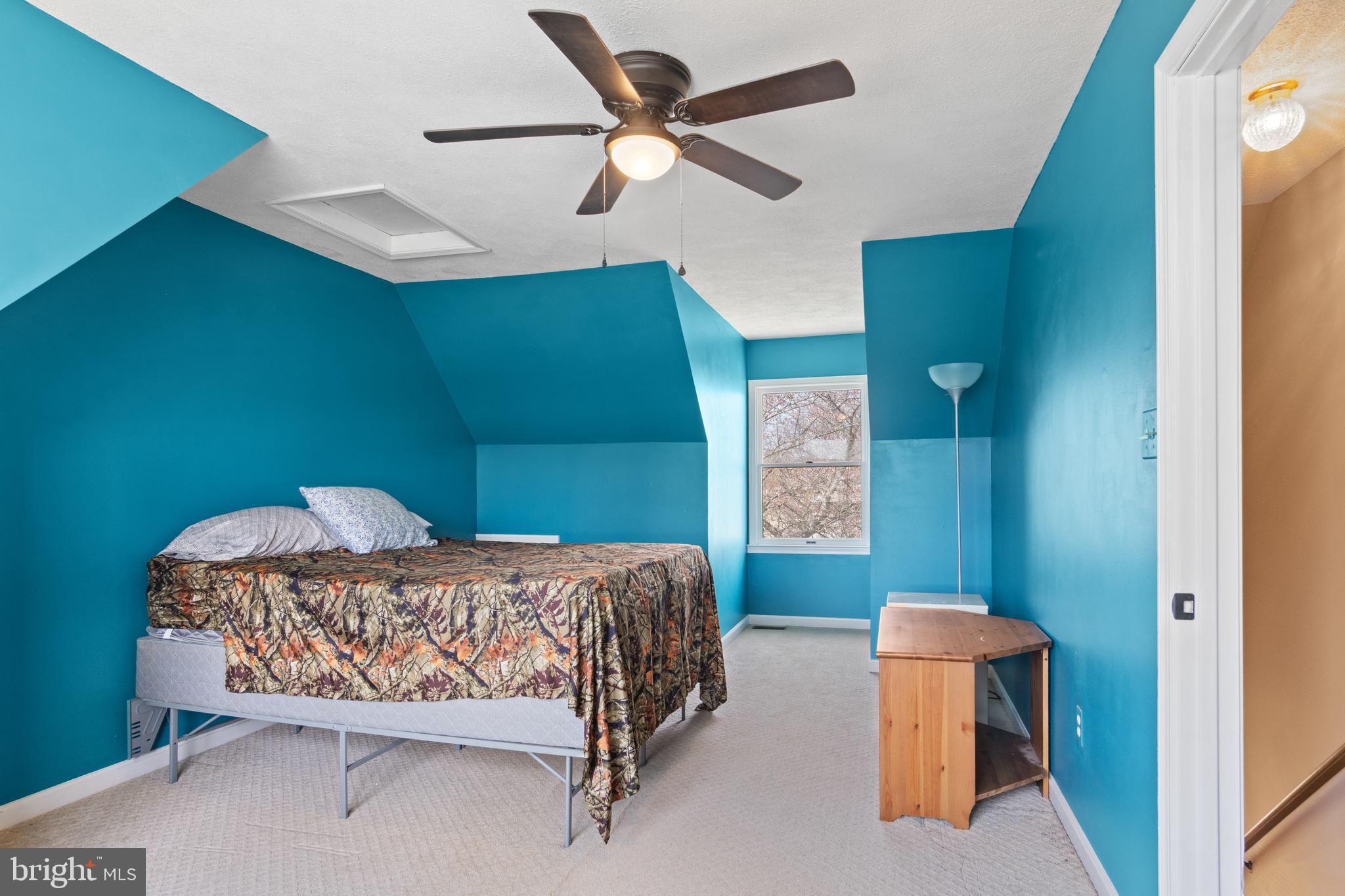 1636 Harrier Lane Culpeper, VA 22701 - Photo 12 of 19 a bedroom with a bed and a chandelier