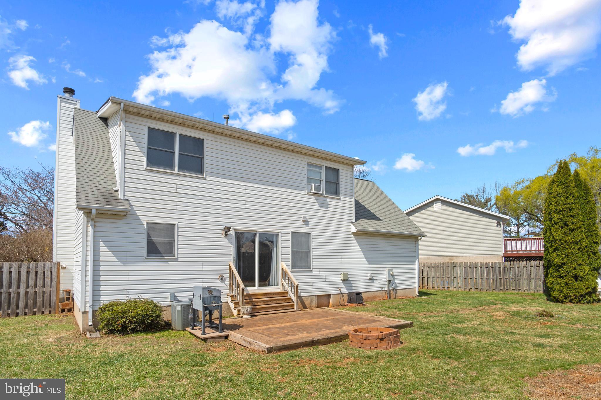 1636 Harrier Lane Culpeper, VA 22701 - Photo 19 of 19 a backyard of a house with table and chairs