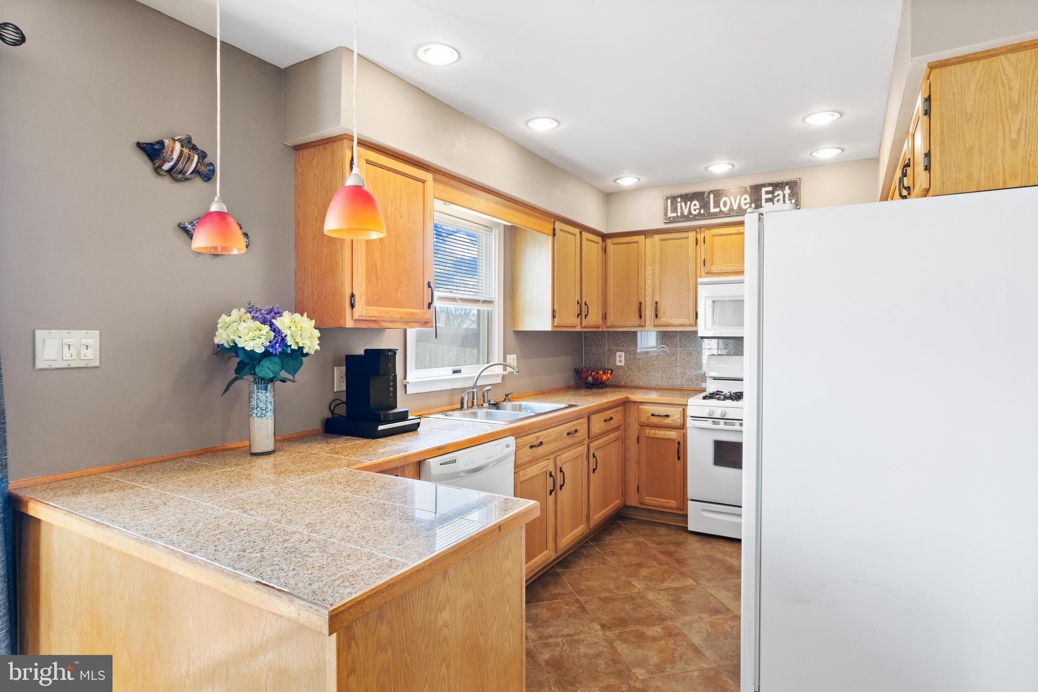1636 Harrier Lane Culpeper, VA 22701 - Photo 4 of 19 a kitchen with stainless steel appliances granite countertop sink stove and refrigerator
