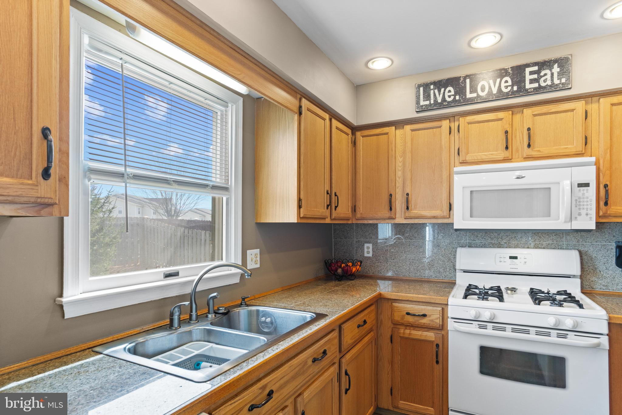 1636 Harrier Lane Culpeper, VA 22701 - Photo 5 of 19 a kitchen with a stove a sink and a cabinets