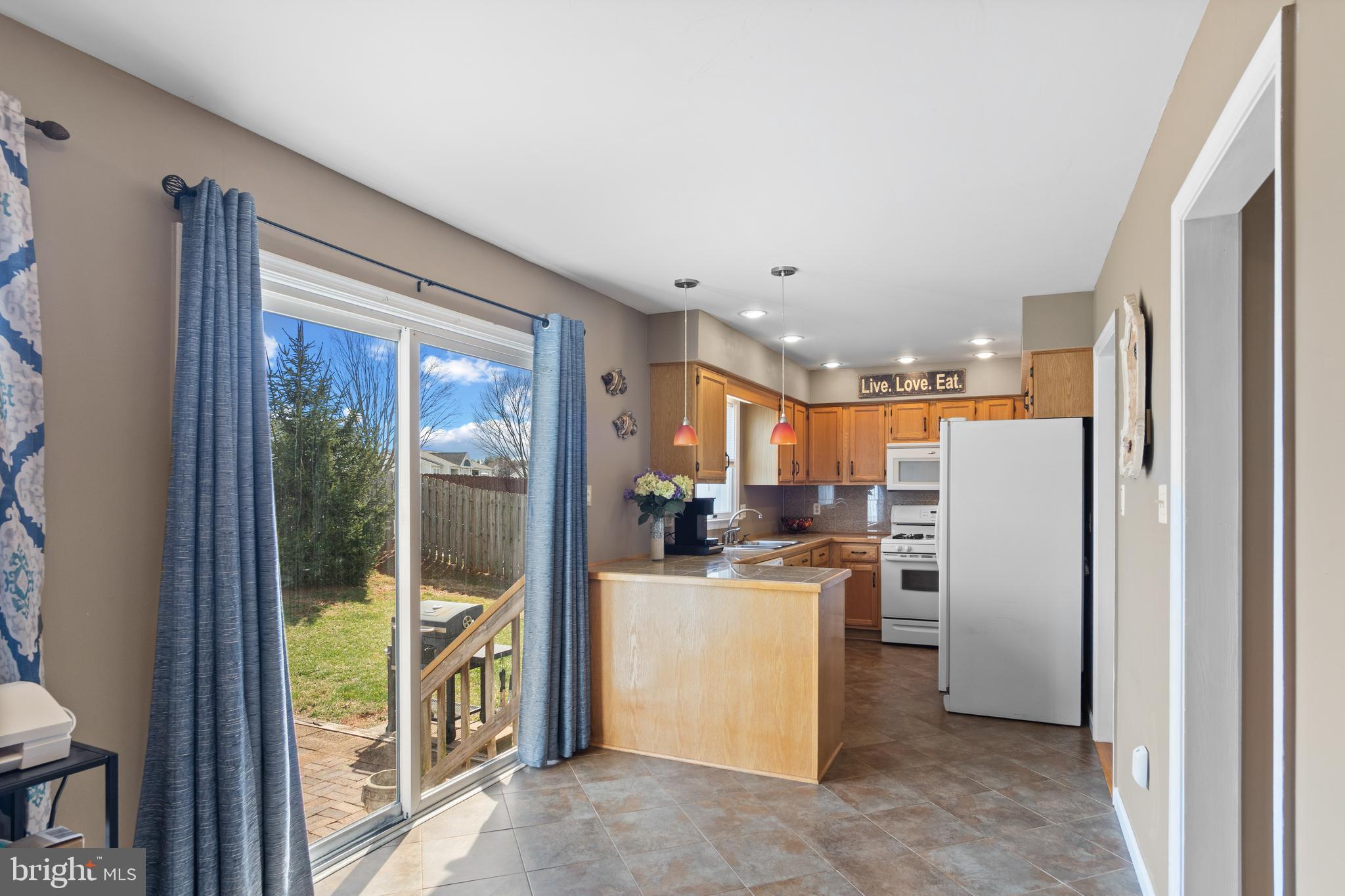 1636 Harrier Lane Culpeper, VA 22701 - Photo 6 of 19 a kitchen with a refrigerator a stove and a refrigerator