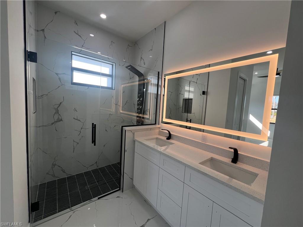 3510 15th Street Southwest Lehigh Acres, FL 33976 - Photo 36 of 50 Bathroom with vanity and walk in shower