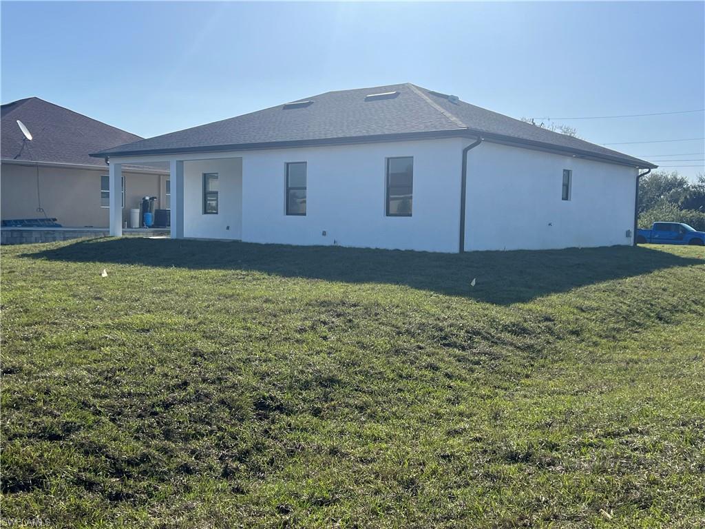 3510 15th Street Southwest Lehigh Acres, FL 33976 - Photo 40 of 50 Back of property featuring a yard