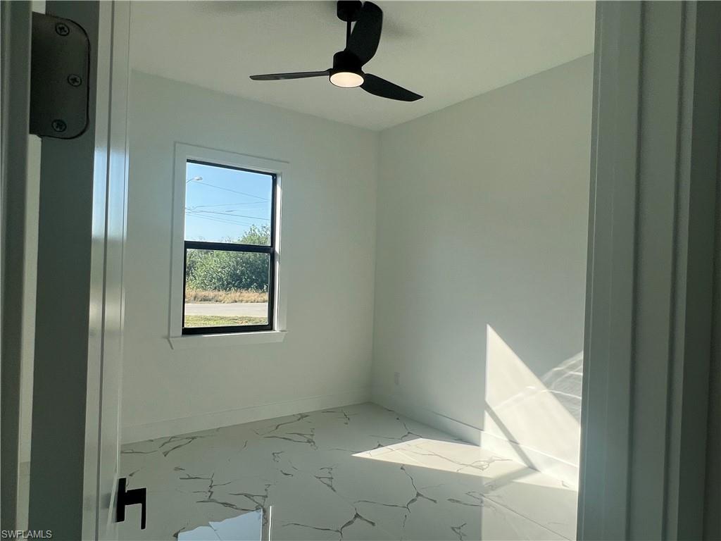 3510 15th Street Southwest Lehigh Acres, FL 33976 - Photo 43 of 50 Unfurnished room featuring ceiling fan