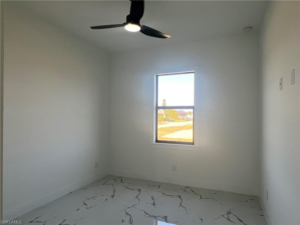 3510 15th Street Southwest Lehigh Acres, FL 33976 - Photo 44 of 50 Empty room with ceiling fan