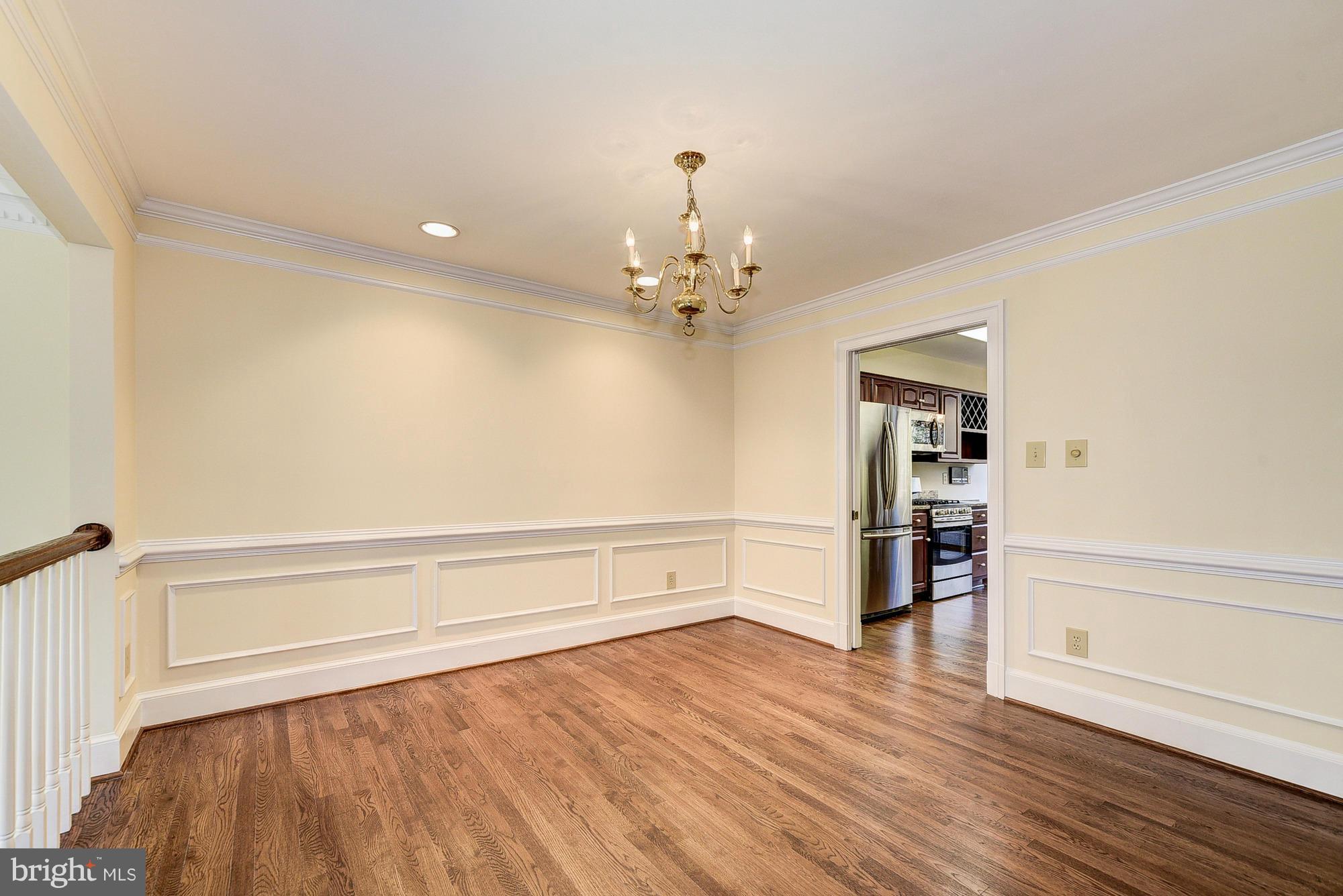 8023 Rising Ridge Road Bethesda, MD 20817 - Photo 5 of 30 wooden floor in an empty room with a window
