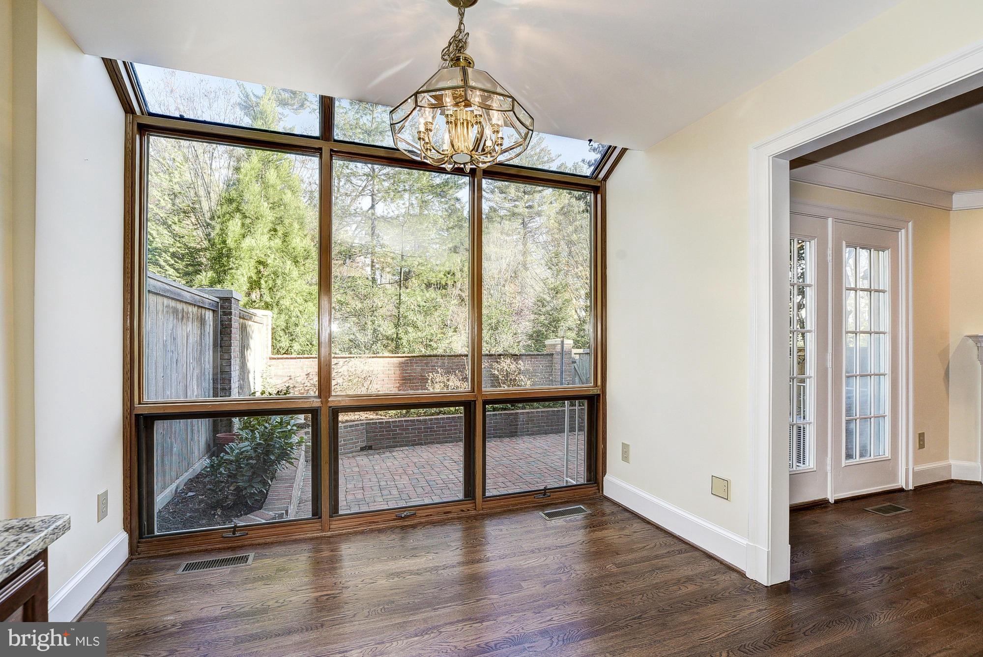 8023 Rising Ridge Road Bethesda, MD 20817 - Photo 10 of 30 a view of an empty room with wooden floor and a window