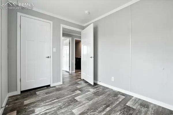 a view of a room with wooden floor