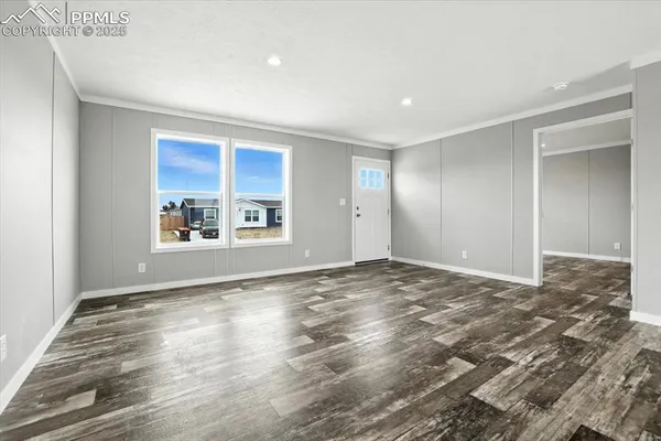 a view of an empty room and window