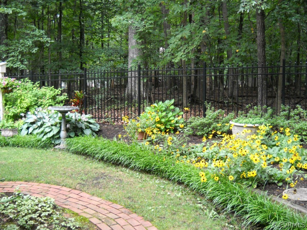 2911 East Brigstock Road Midlothian, VA 23113 - Photo 4 of 20 Brick path winds through landscaped area (lot goes