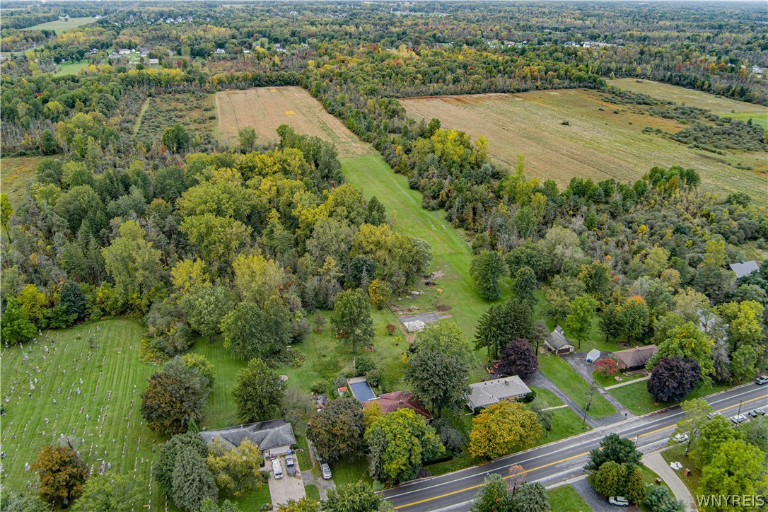 6775 Bear Ridge Road Pendleton, NY 14094 - Photo 47 of 48 Lush woodlands and open fields border this expansive property photographed from above.
