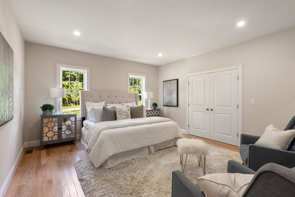 1 Emmeline Path, Unit 1 Wayland, MA 01778 - Photo 11 of 22 a bedroom with a bed and a couch