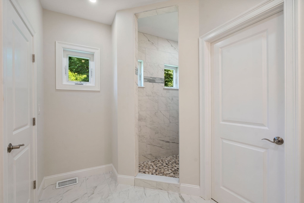 1 Emmeline Path, Unit 1 Wayland, MA 01778 - Photo 13 of 22 a bathroom with a shower