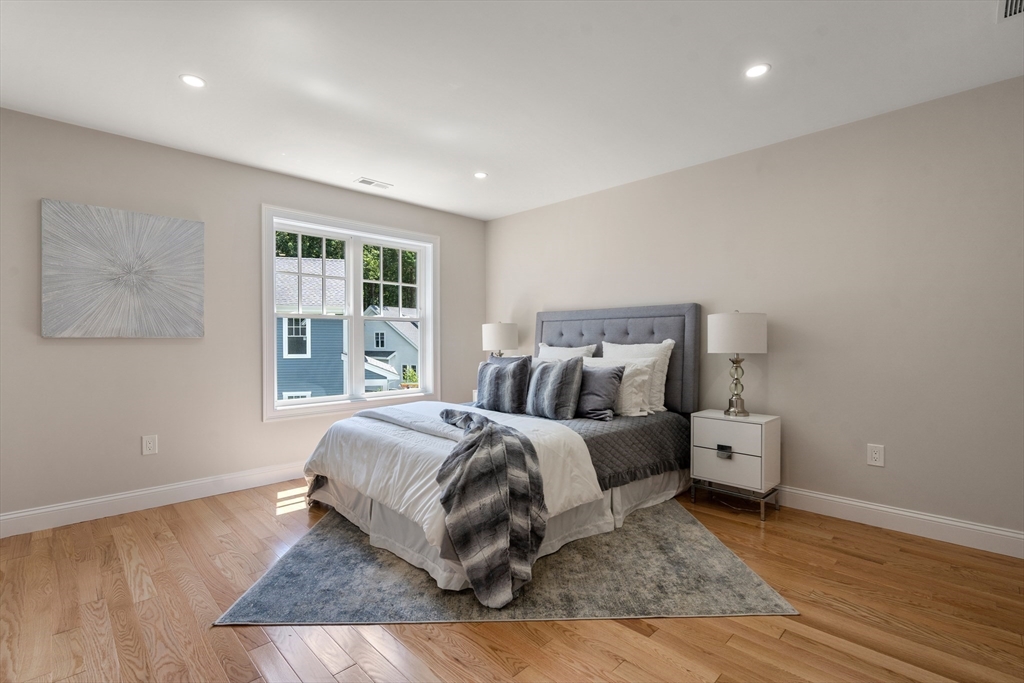 1 Emmeline Path, Unit 1 Wayland, MA 01778 - Photo 15 of 22 a bed room with a bed and a window