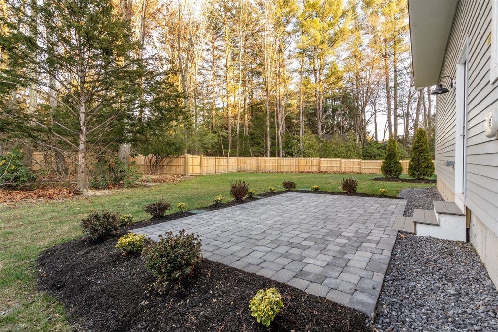 1 Emmeline Path, Unit 1 Wayland, MA 01778 - Photo 19 of 22 a view of a yard with plants and trees