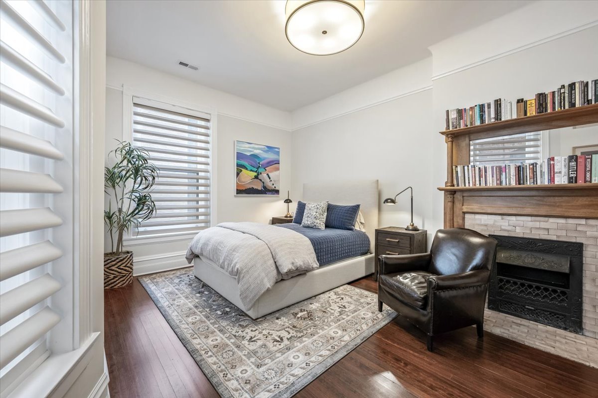 1304 North Ritchie Court Chicago, IL 60610 - Photo 20 of 28 a bedroom with furniture and a fireplace