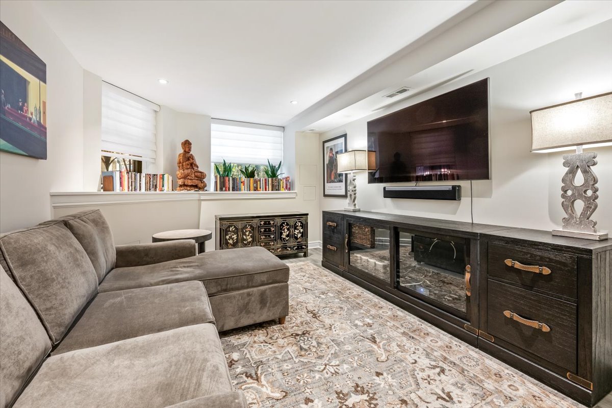 1304 North Ritchie Court Chicago, IL 60610 - Photo 23 of 28 a living room with furniture and a flat screen tv