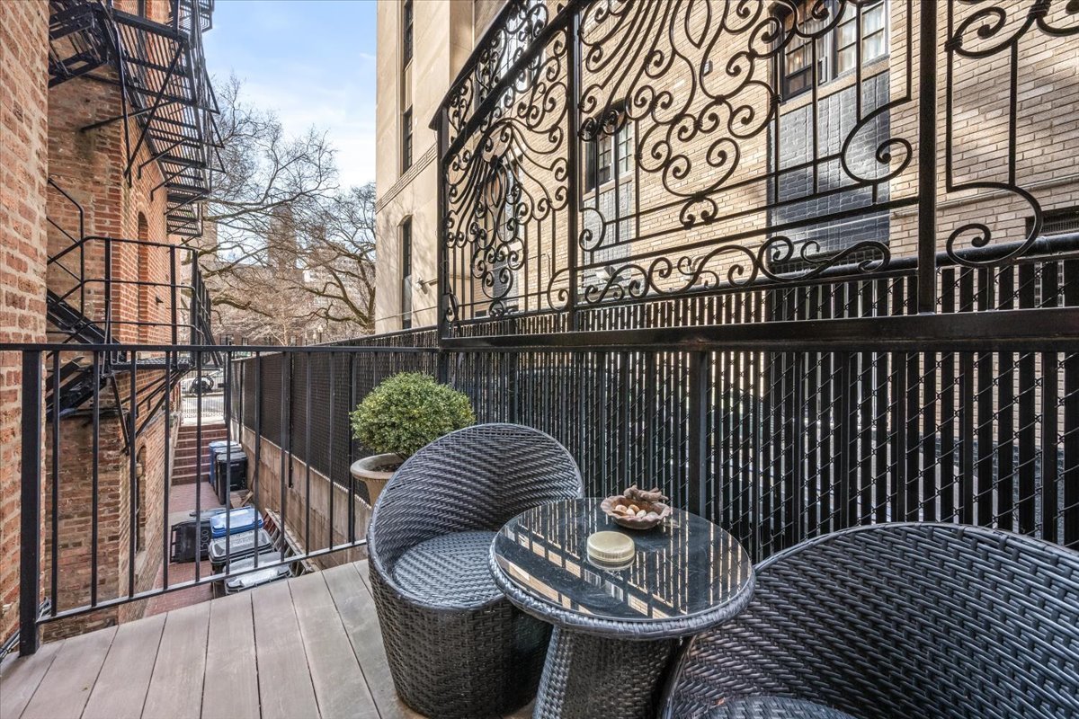 1304 North Ritchie Court Chicago, IL 60610 - Photo 28 of 28 a balcony with table and chairs