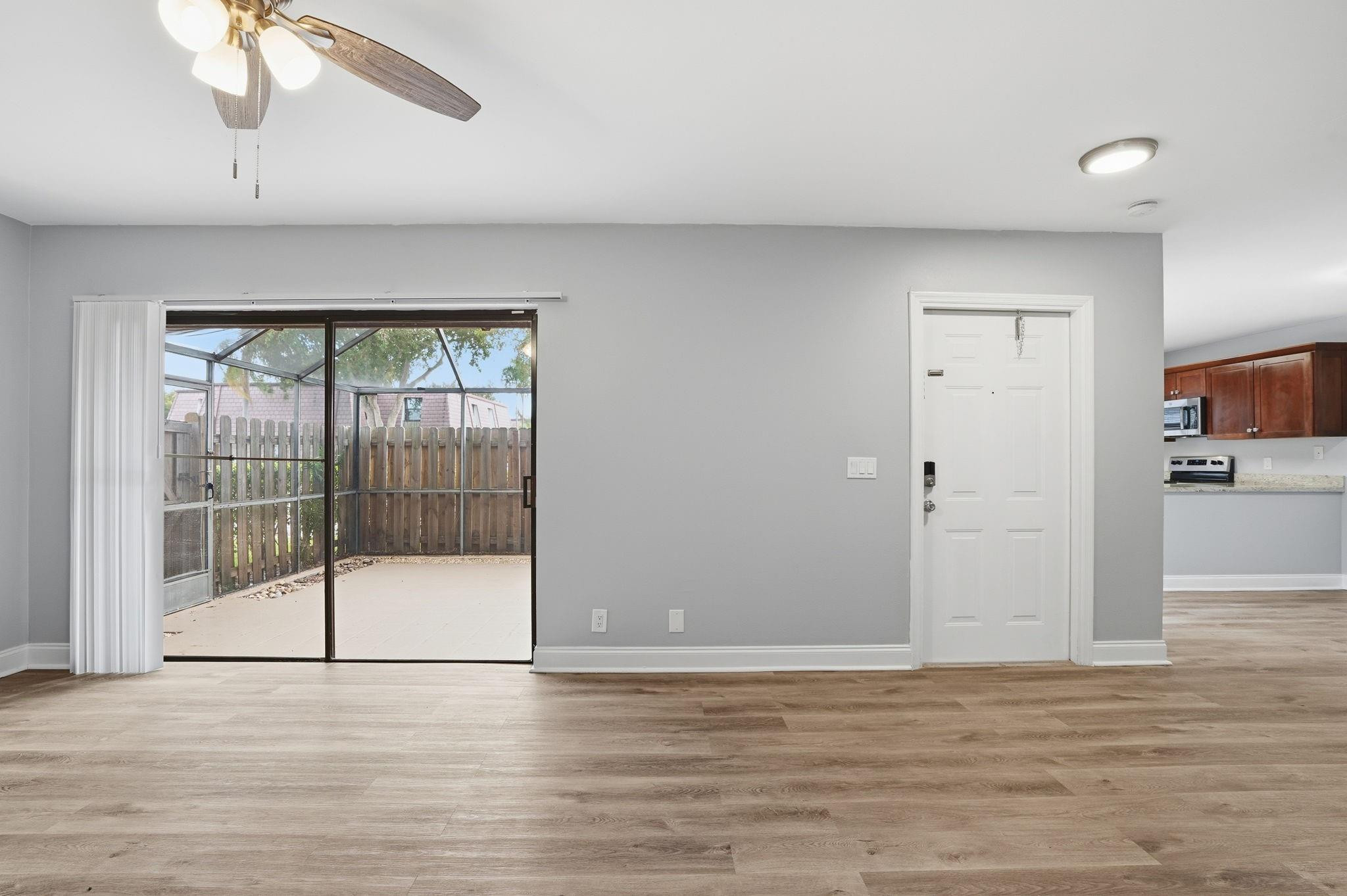 7600 Courtyard Run West Boca Raton, FL 33433 - Photo 11 of 34 a view of a livingroom with wooden floor and cabinet